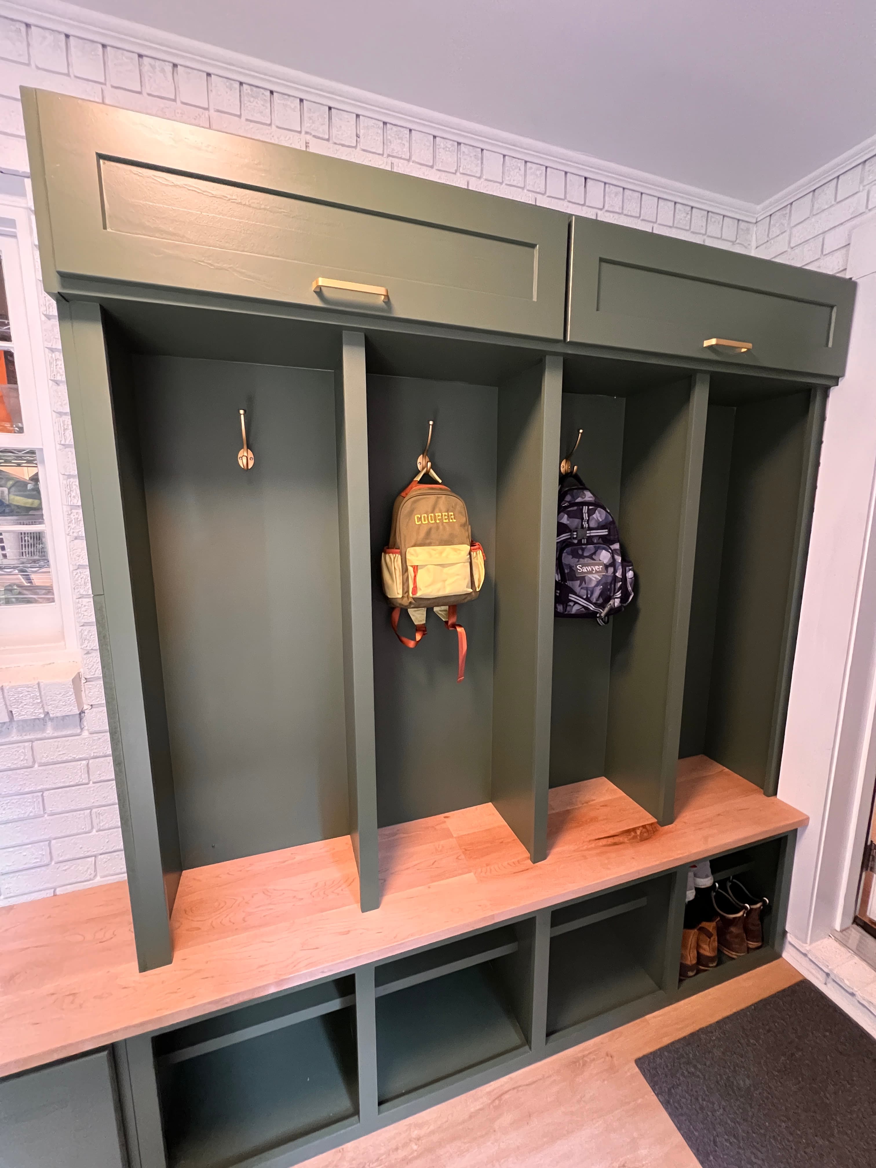 Green custom mudroom cubby storage unit with bench