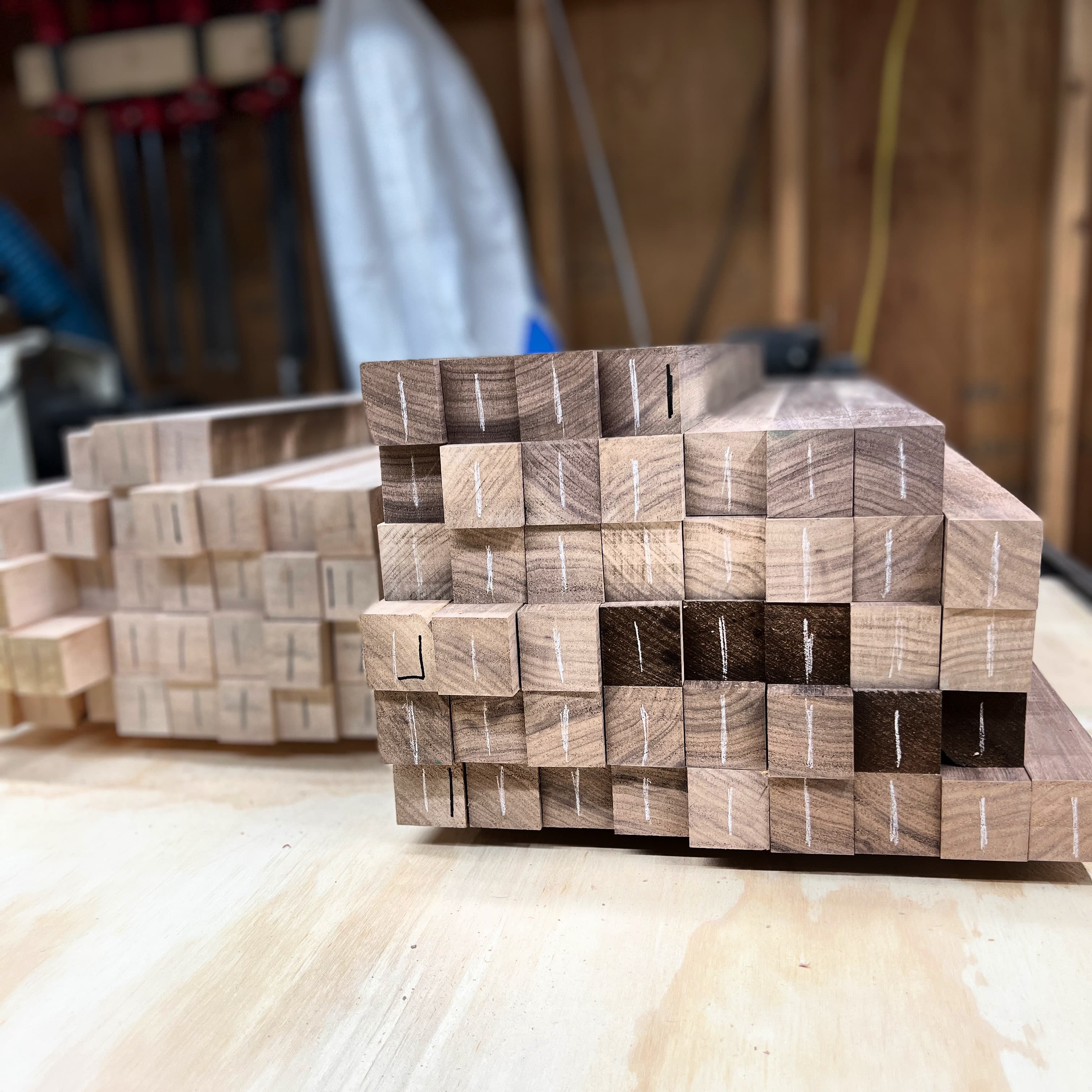 Walnut and maple edge grain boards stacked