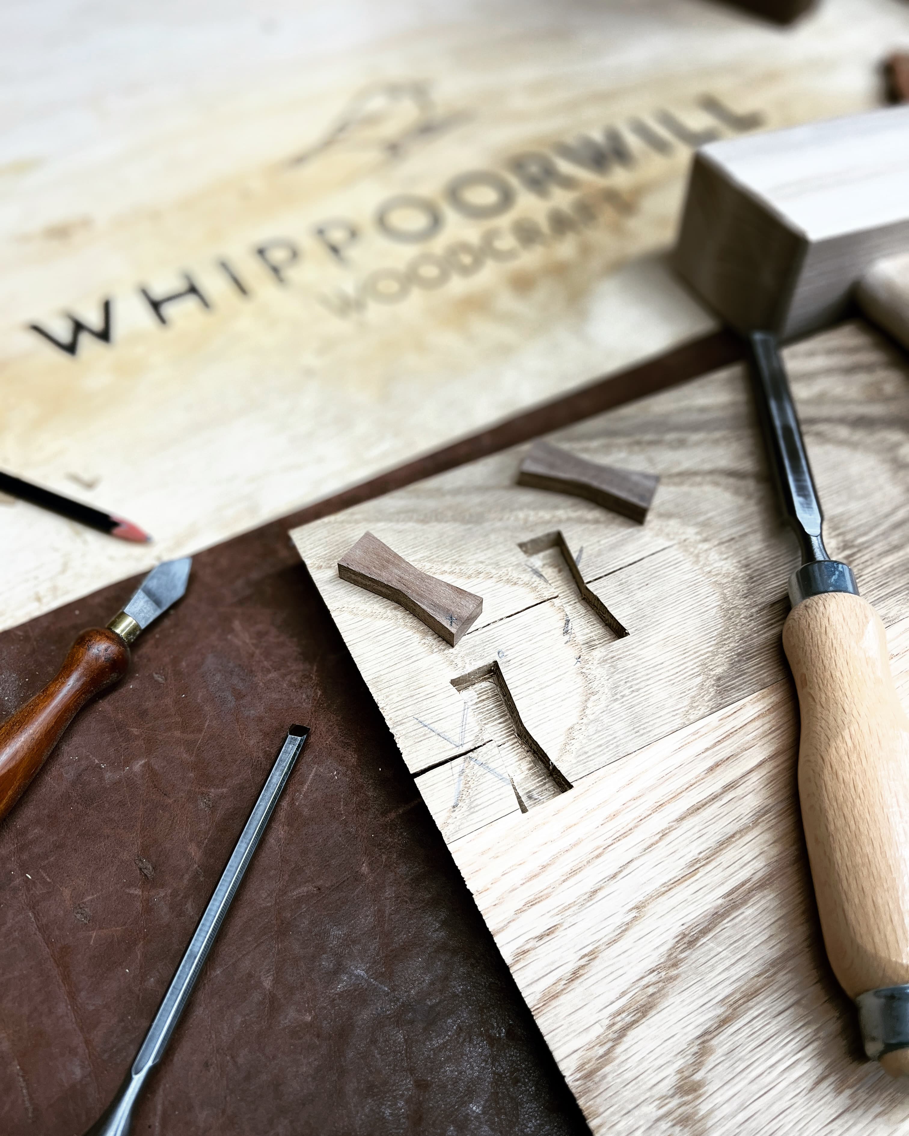 Woodworking tools and wall letter in process